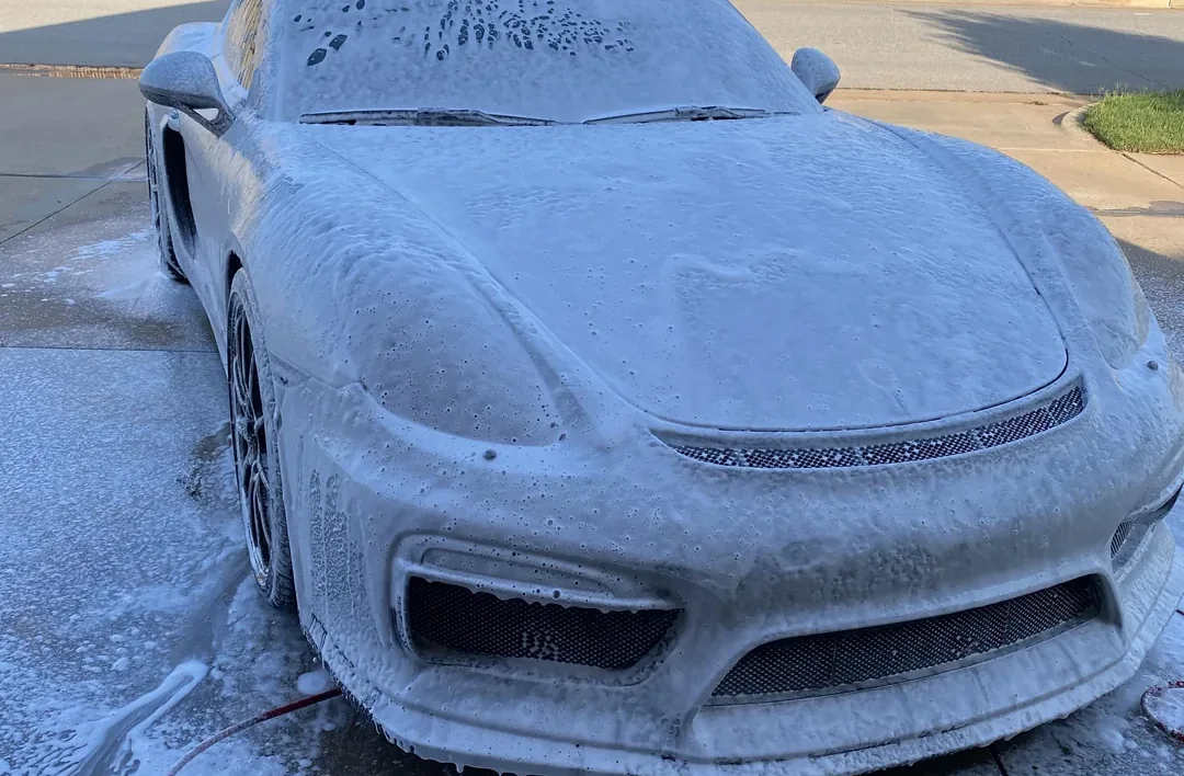 Car covered in foam during an exterior detail